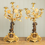 A Pair of 19th Century French Gilt Bronze Figural Candelabra In The Manner Of Clodion