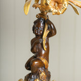 A Pair of 19th Century French Gilt Bronze Figural Candelabra In The Manner Of Clodion